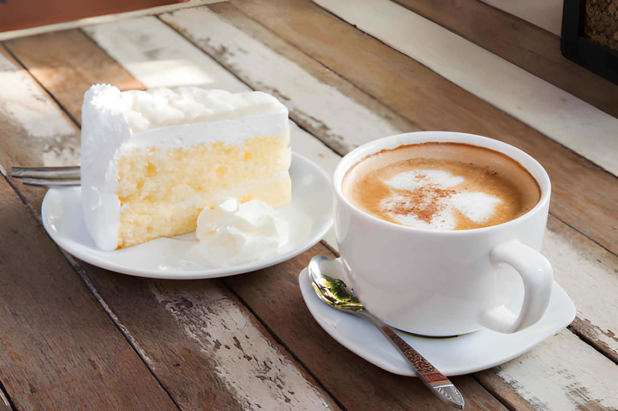 a slice of cheesecake and a cup of coffee