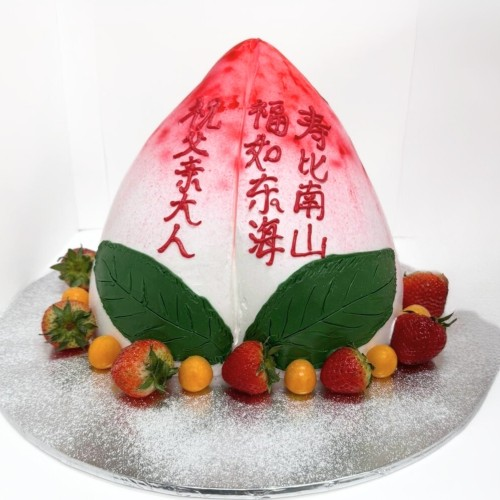 a 3d peach longevity cake