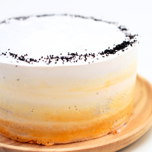 a close up shot of sweet peach earl grey cake