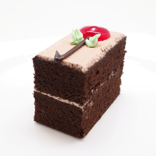 a slice of chocolate buttercream cake